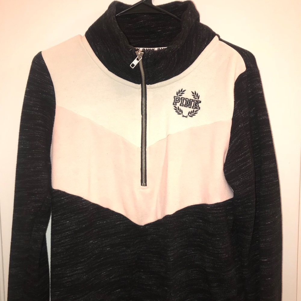 Pink half-zipped pull over.